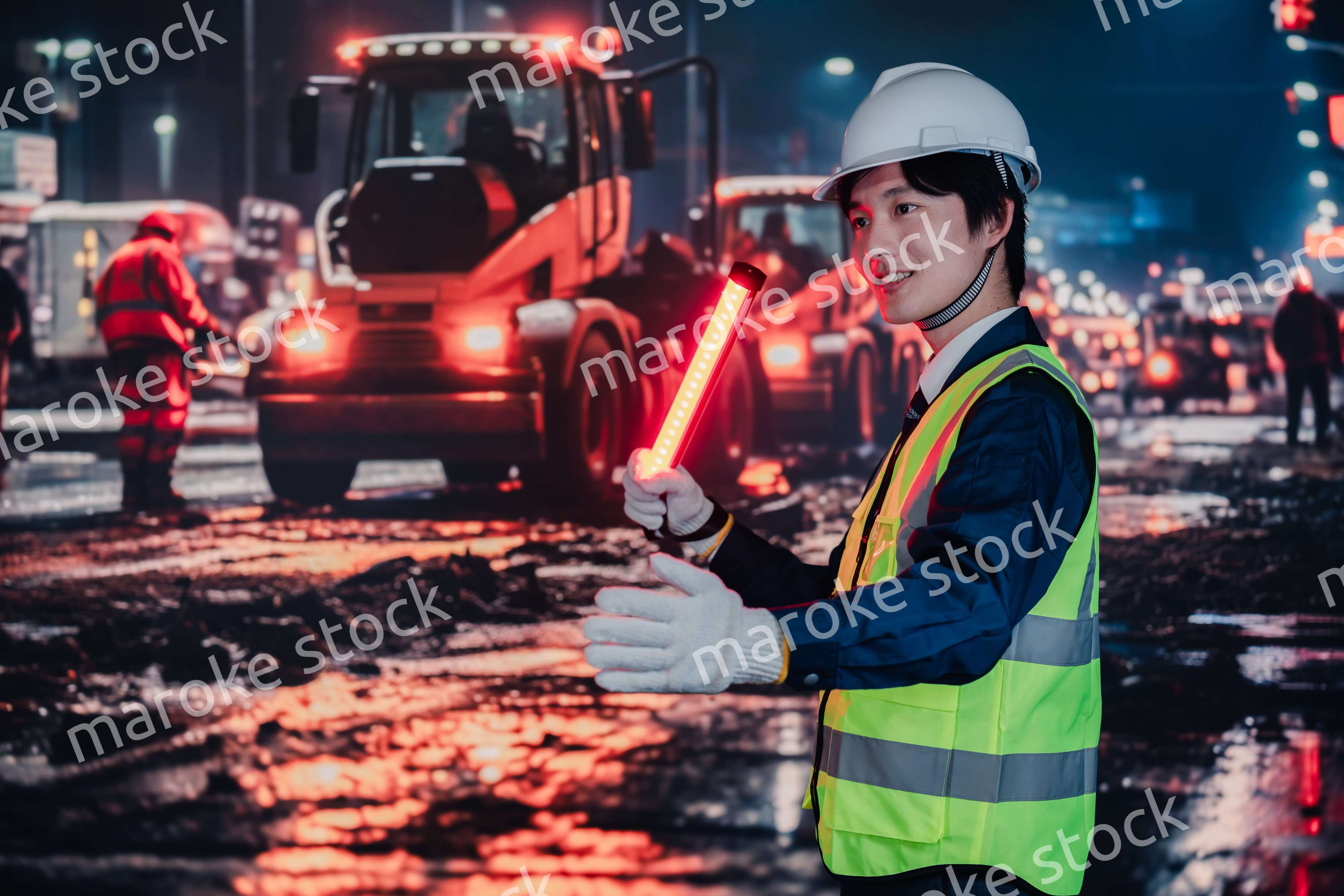 道路で交通整理をする警備員