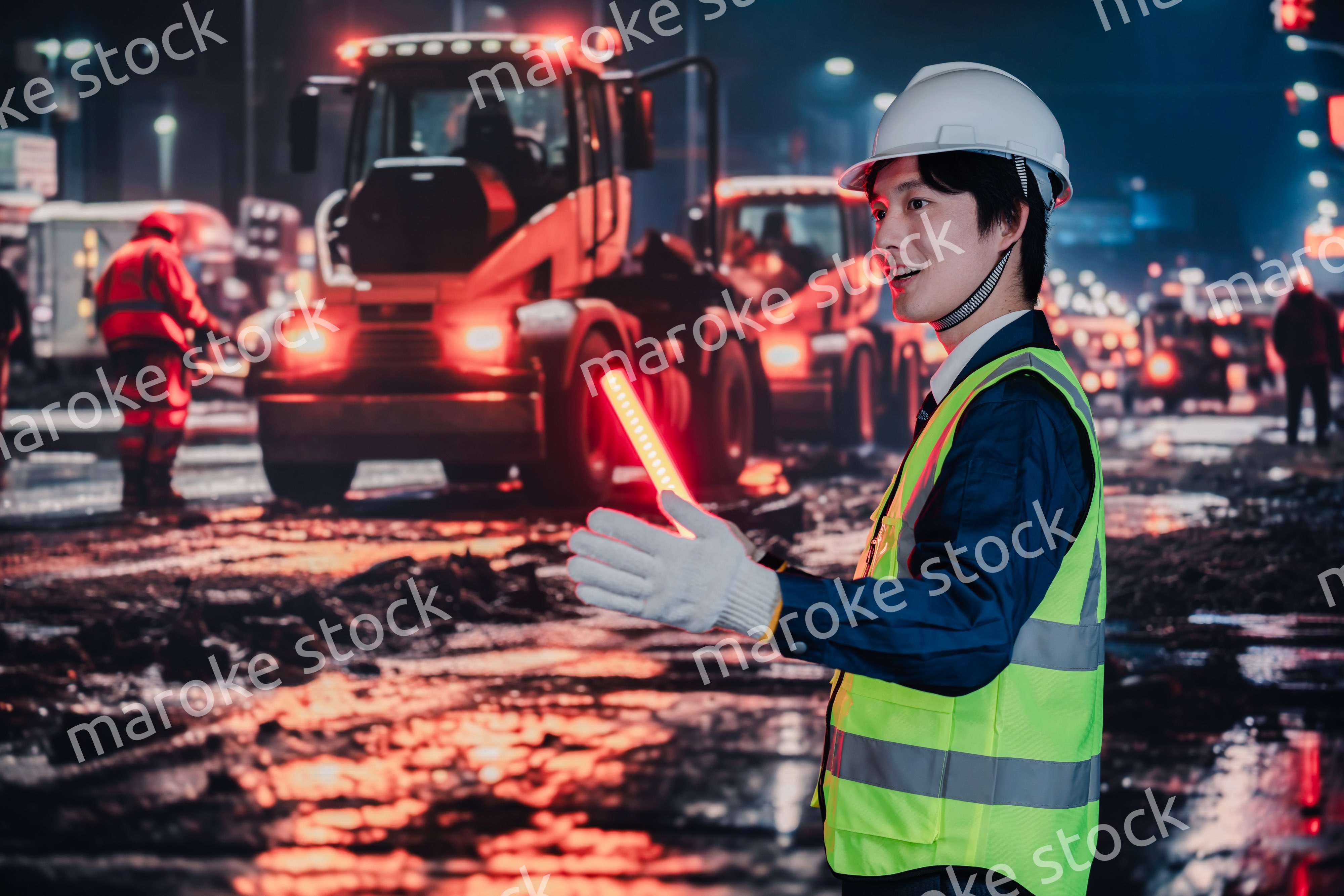 道路で交通整理をする警備員