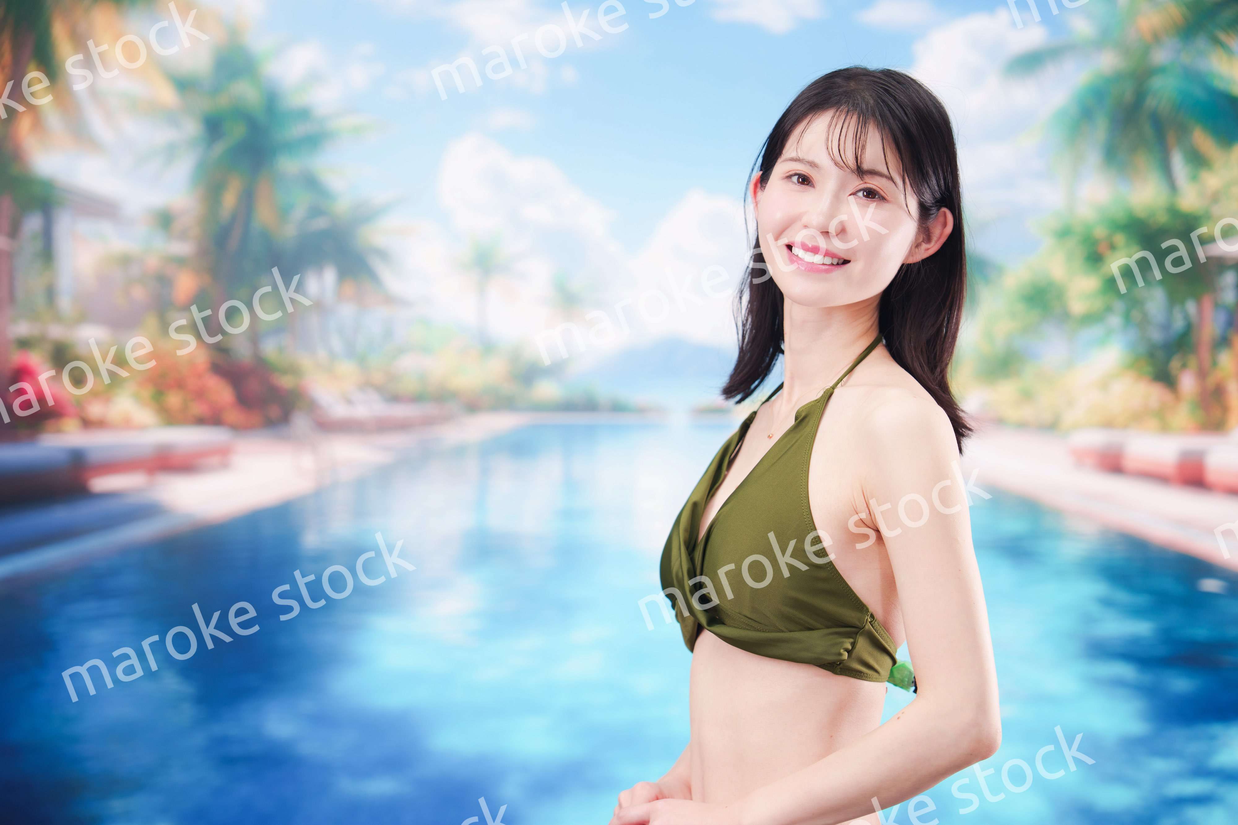 リゾートのプールで夏を楽しむ若い女性