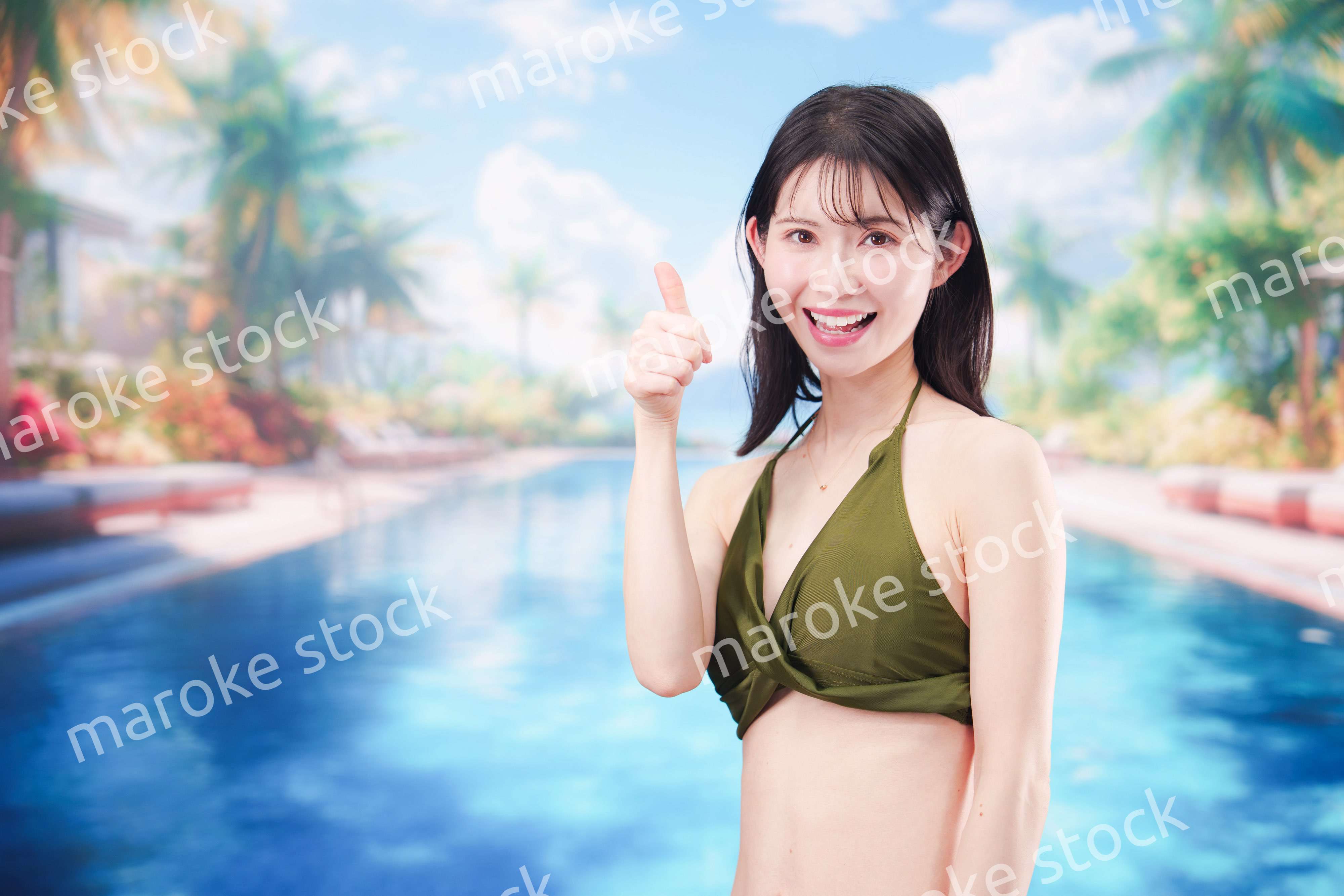 リゾートのプールで夏を楽しむ若い女性
