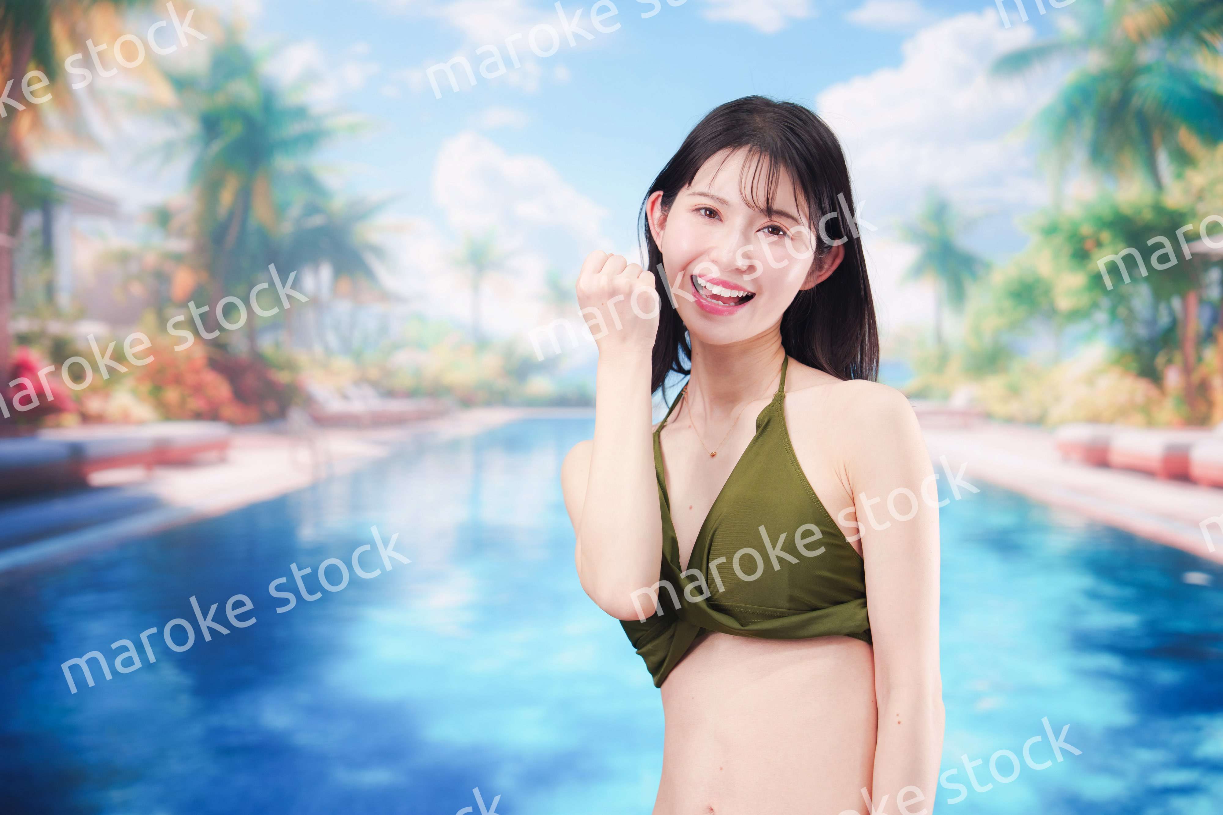 リゾートのプールで夏を楽しむ若い女性