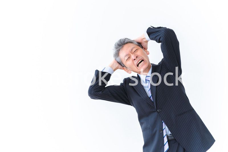 頭を抱える経営者