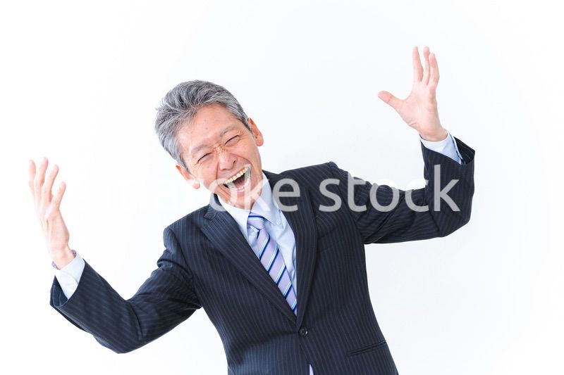 大爆笑をするビジネスマン