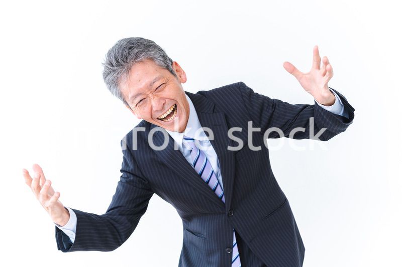 大爆笑をするビジネスマン