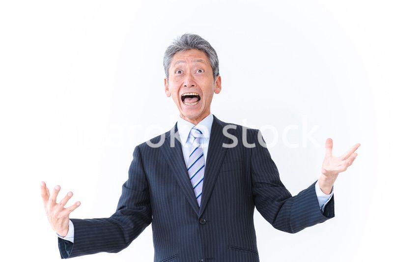 大爆笑をするビジネスマン