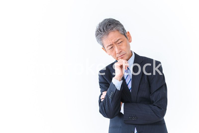 悩む経営者