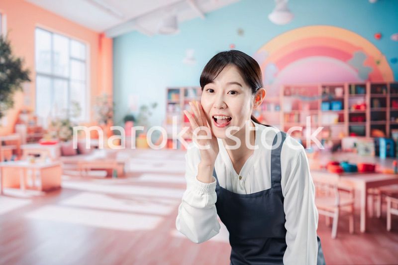 子供と仲良く接する保育士