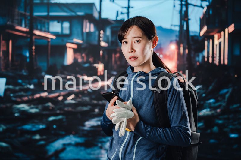 災害に遭い途方に暮れる女性