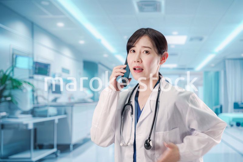 緊急の電話で慌てる医療スタッフ