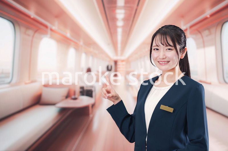 ラグジュアリーな鉄道で乗務員をする若い女性