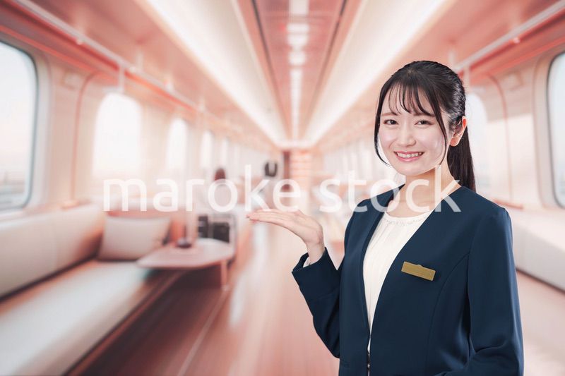 ラグジュアリーな鉄道で乗務員をする若い女性