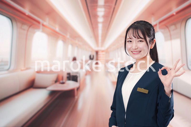 ラグジュアリーな鉄道で乗務員をする若い女性