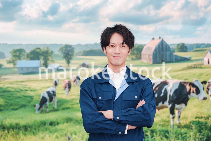 牧場で働く若い男性