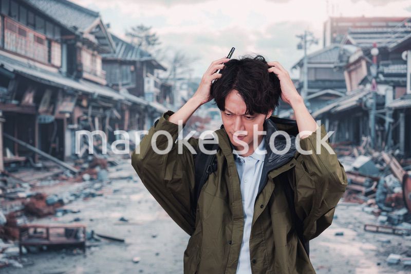 地震で被災した男性