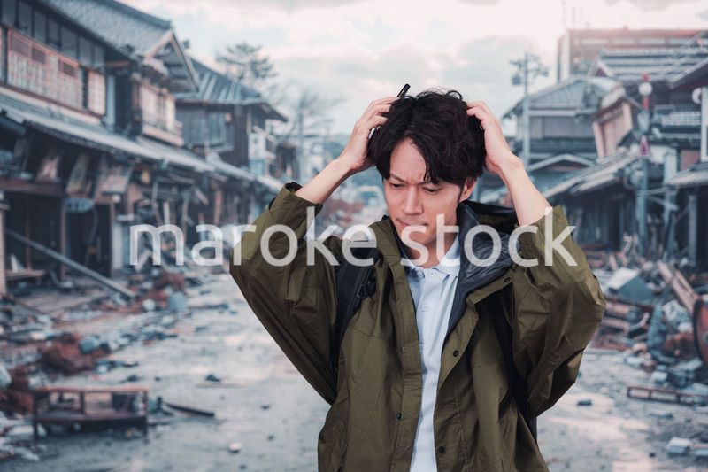 地震で被災した男性