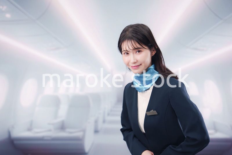 笑顔でお客様を迎えるキャビンアテンダント