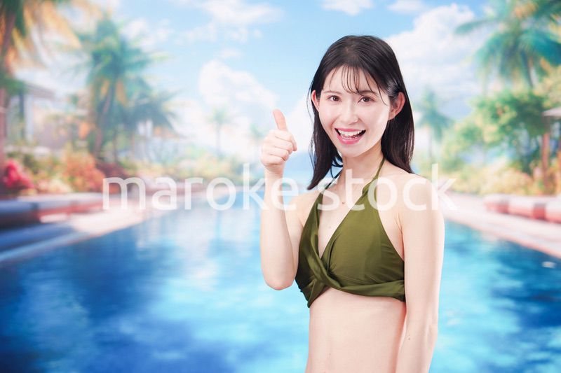 リゾートのプールで夏を楽しむ若い女性