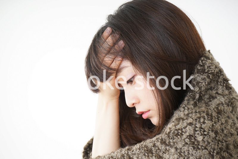 風邪で発熱した若い女性