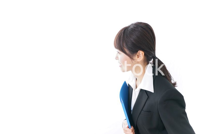 お辞儀をするビジネスウーマン