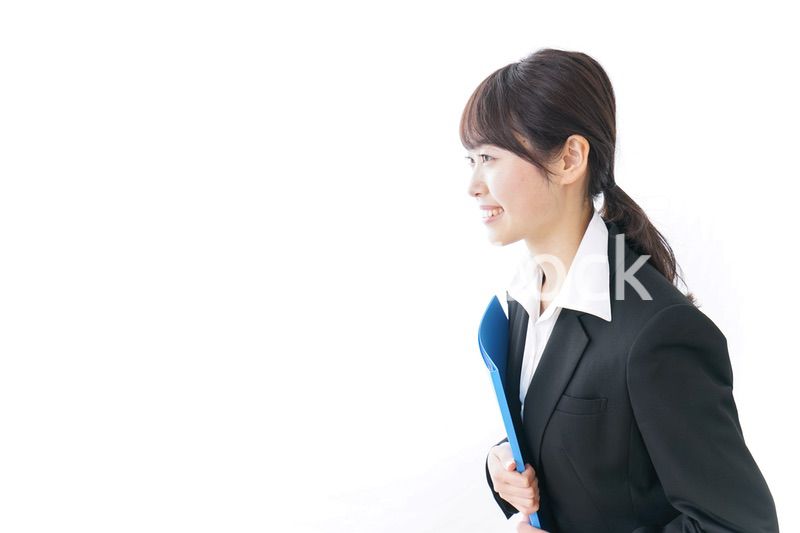 お辞儀をするビジネスウーマン