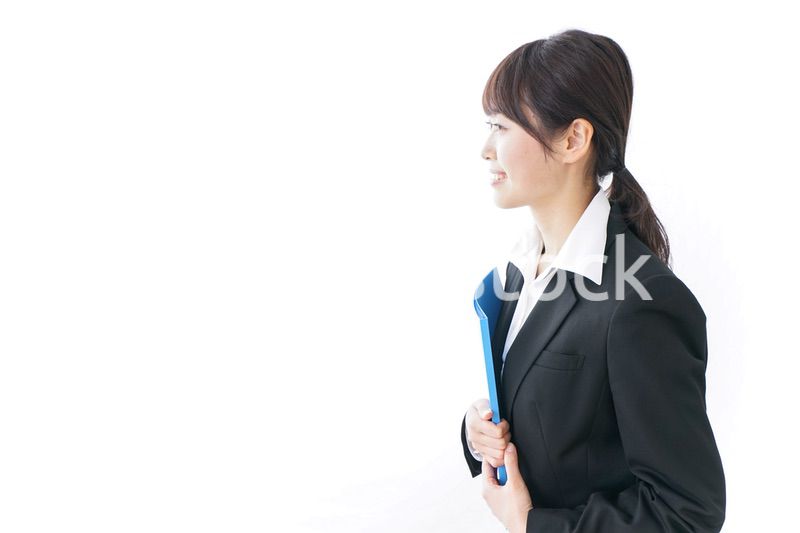 お辞儀をするビジネスウーマン