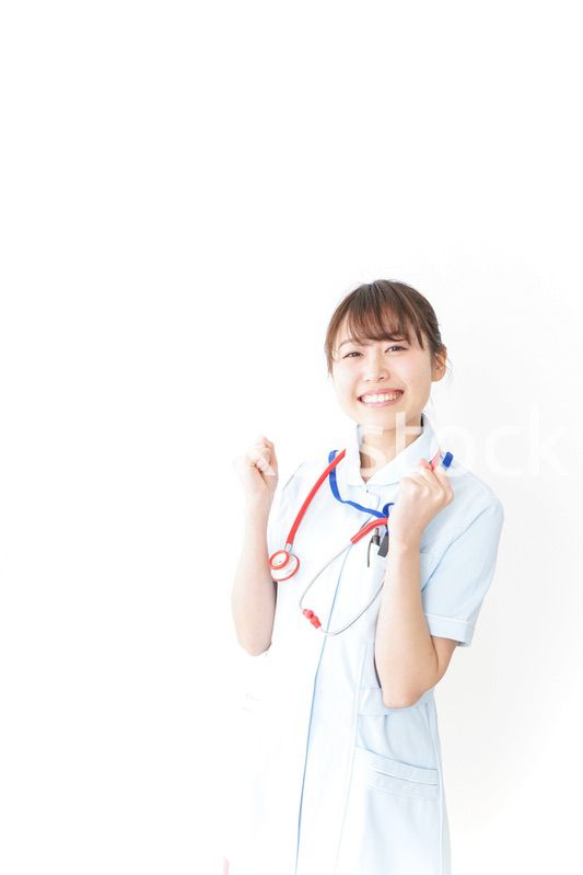 ガッツポーズをするナース