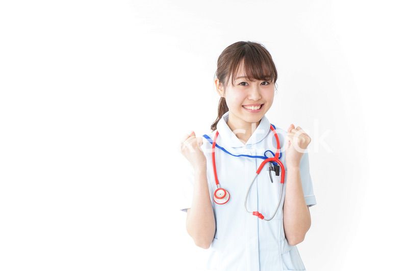 ガッツポーズをするナース
