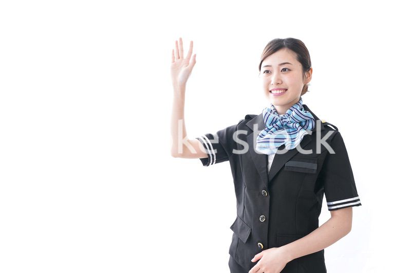 手を振るキャビンアテンダント