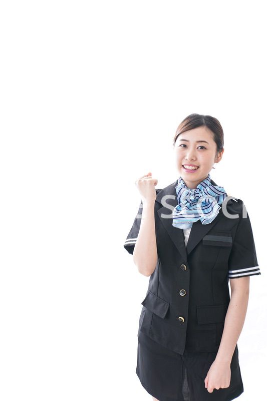 ガッツポーズをするキャビンアテンダント