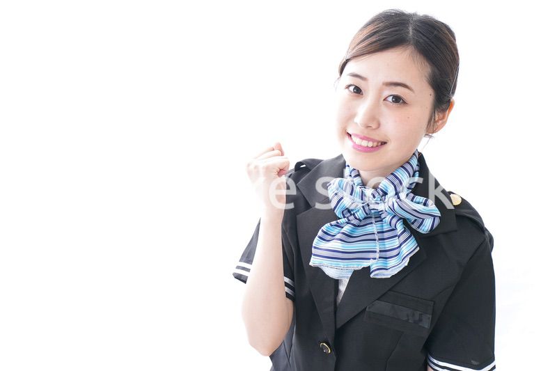 ガッツポーズをするキャビンアテンダント