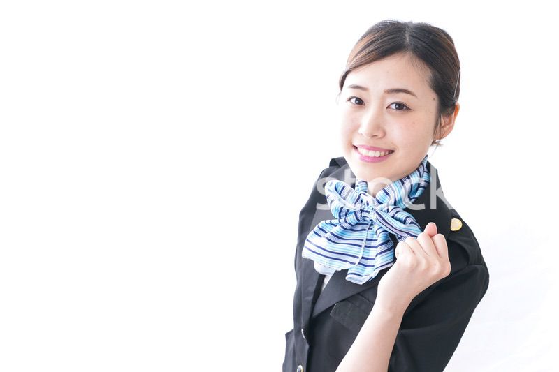 ガッツポーズをするキャビンアテンダント