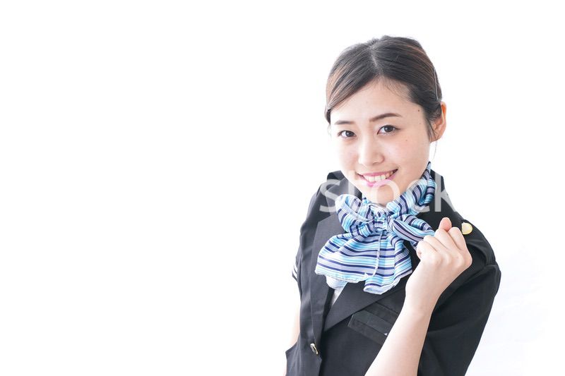 ガッツポーズをするキャビンアテンダント