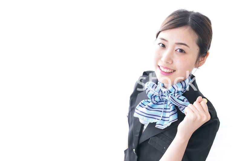 ガッツポーズをするキャビンアテンダント