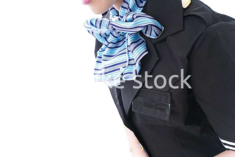 お辞儀をするキャビンアテンダント