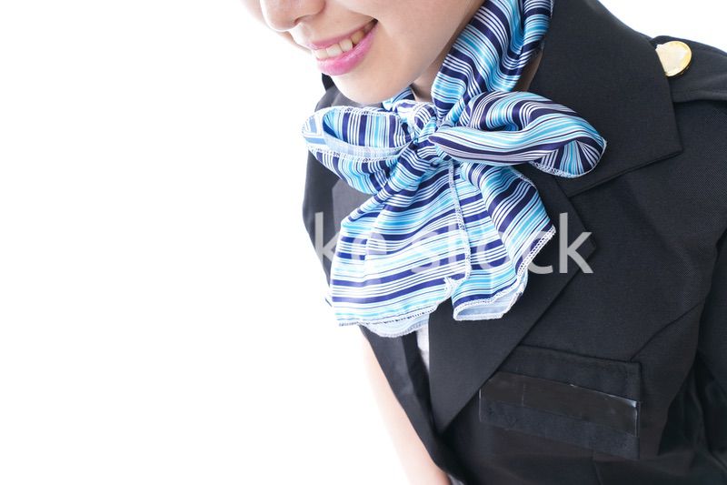 お辞儀をするキャビンアテンダント