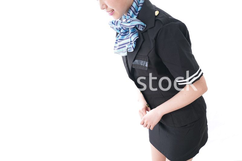 お辞儀をするキャビンアテンダント