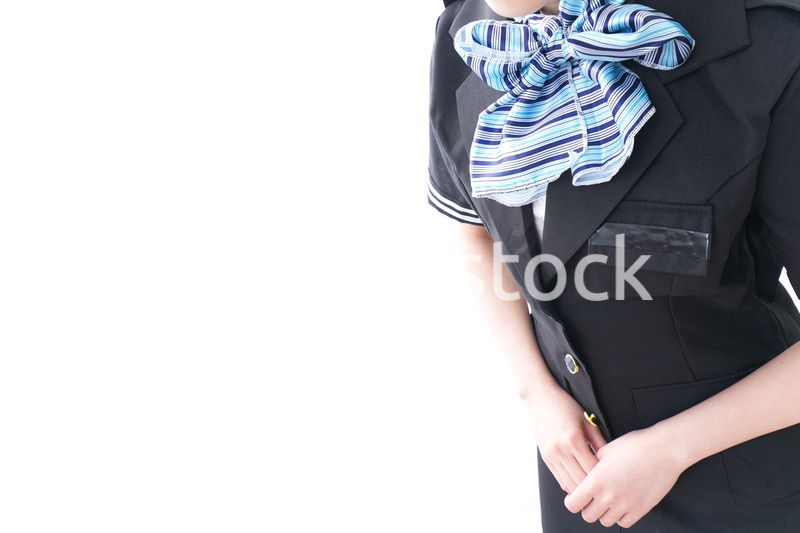 お辞儀をするキャビンアテンダント