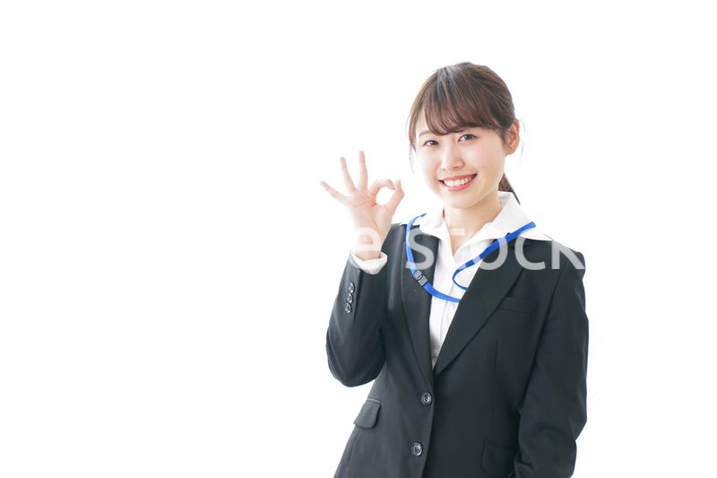 OKサインを示す笑顔のビジネスウーマン