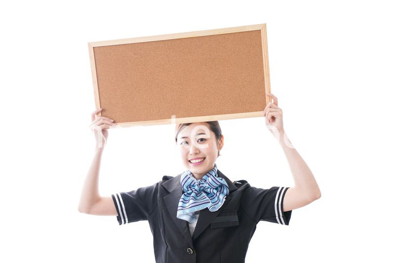 ボードを持つキャビンアテンダント