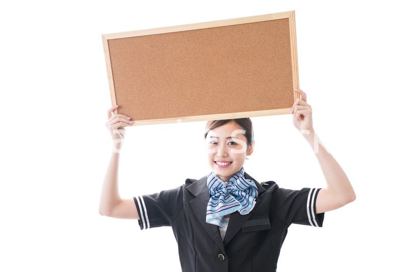 ボードを持つキャビンアテンダント