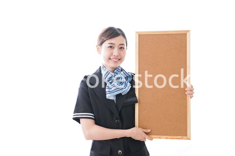 ボードを持つキャビンアテンダント