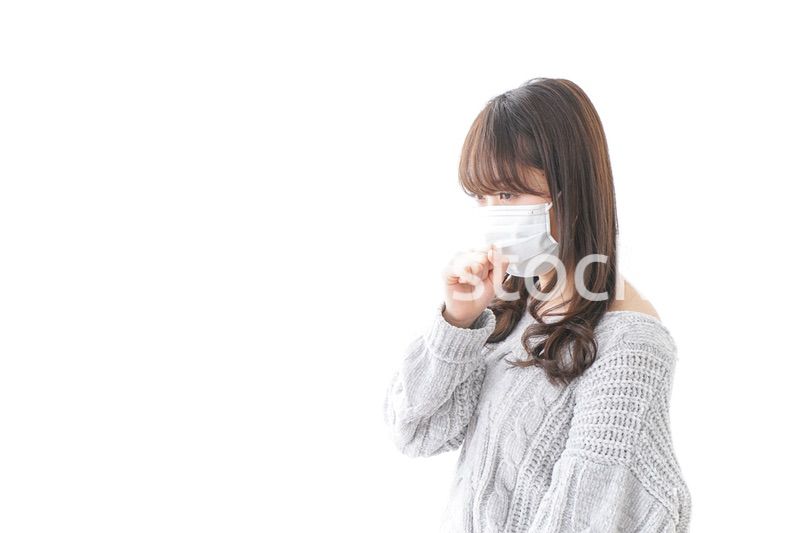 風邪をひいた女性