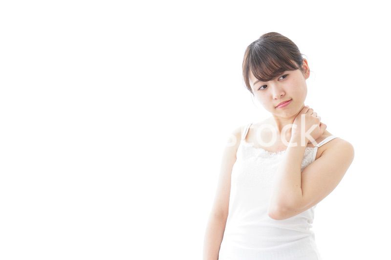 肩こり・関節痛に悩む女性
