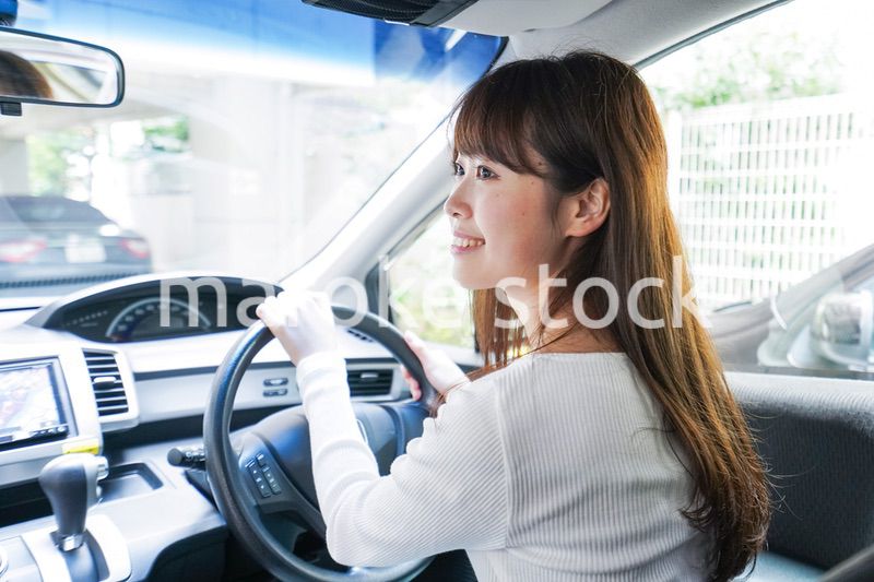 Young woman driving a car