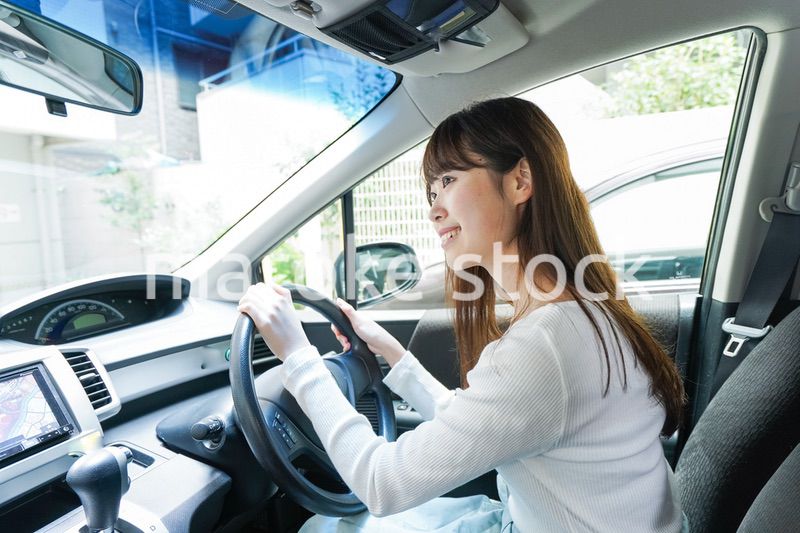Young woman driving a car