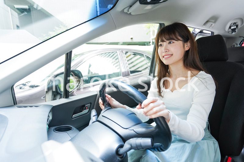 Young woman driving a car