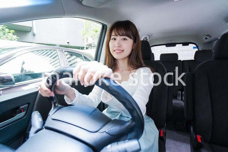 Young woman driving a car