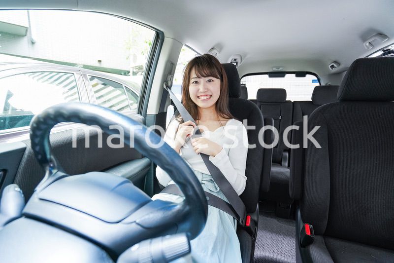 Young woman driving a car