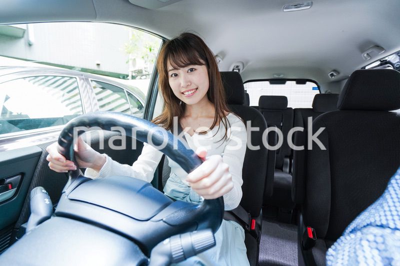 Young woman driving a car