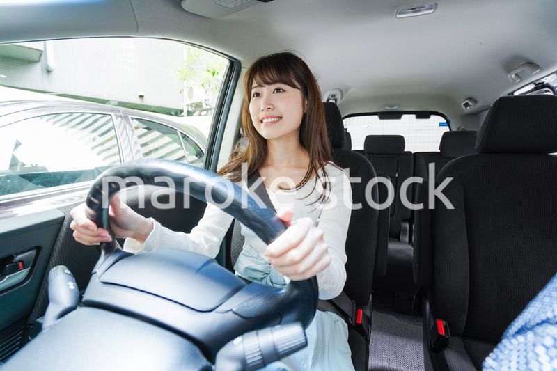 Young woman driving a car